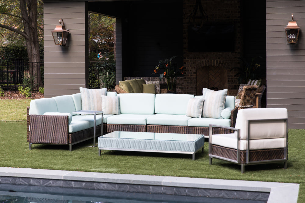 Photo of sectional outdoor on patio next to pool